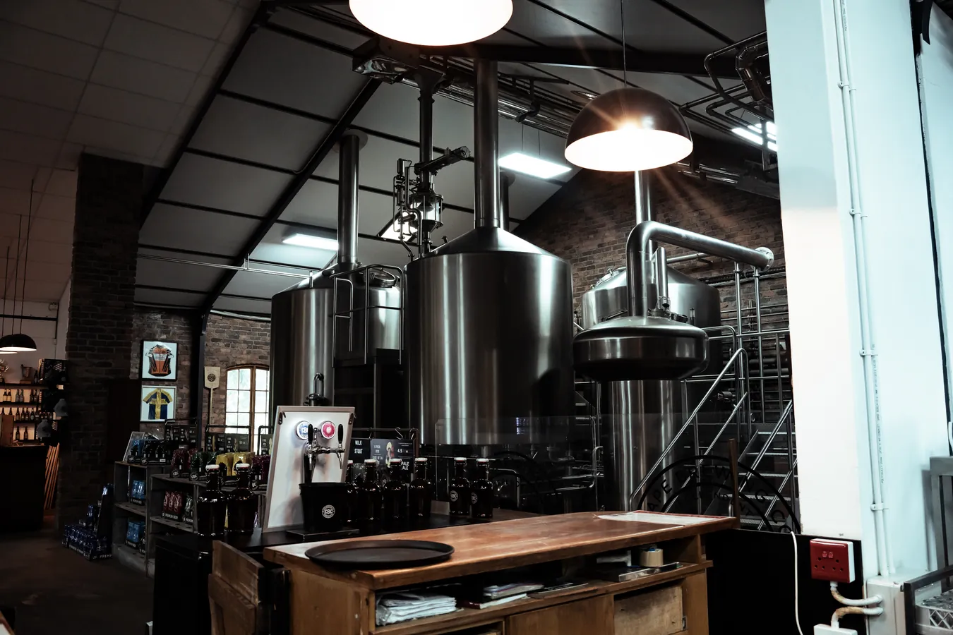 The brewhouse: kettles and platform under the brick walls