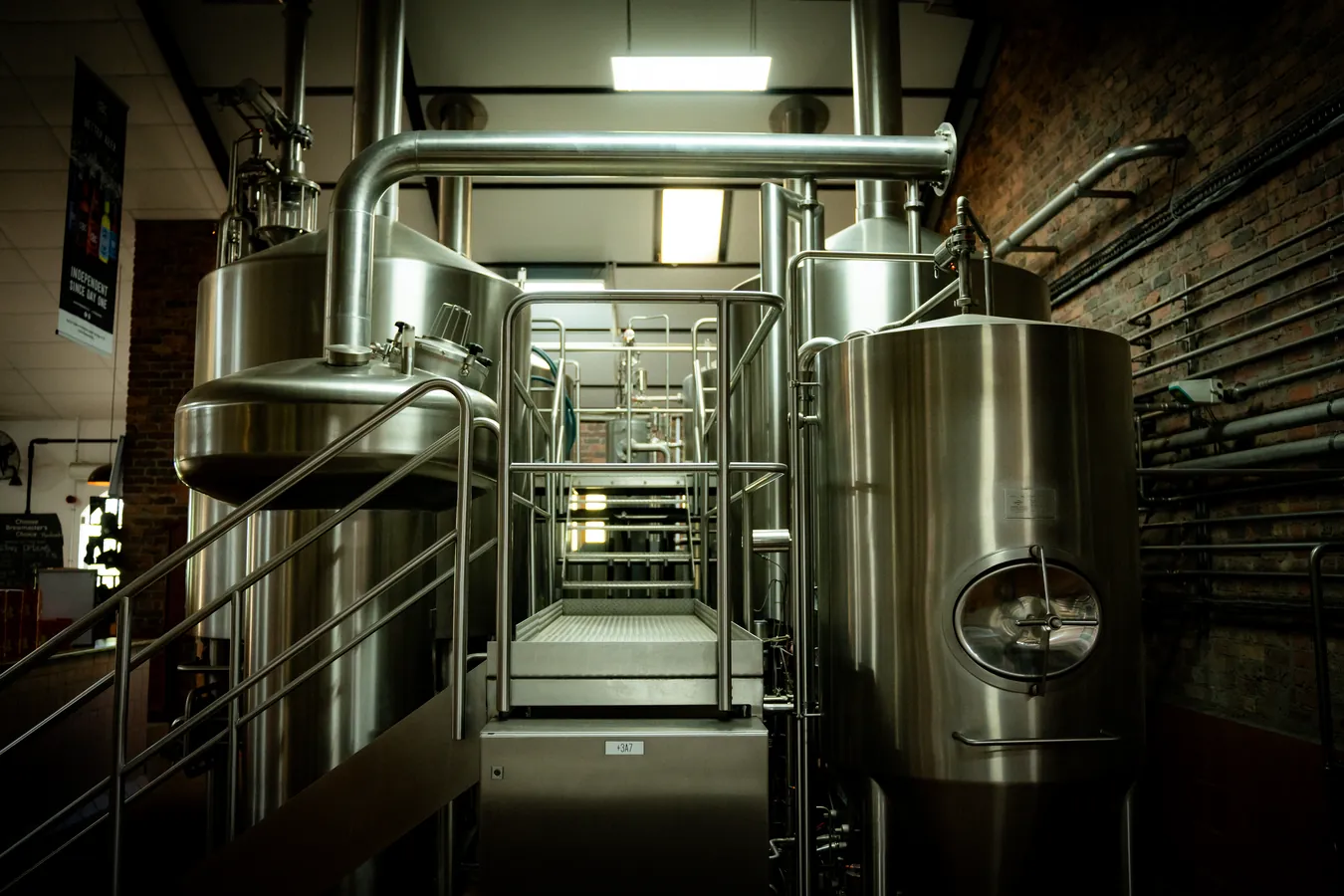 A corridor through the brewhouse between two vessels