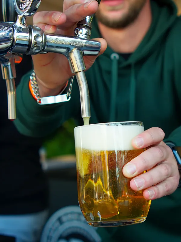 Pulling a pint at the CBC stand