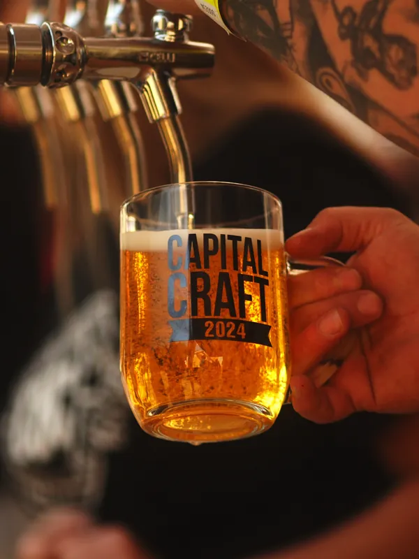 A Capital Craft mug filled at the tap