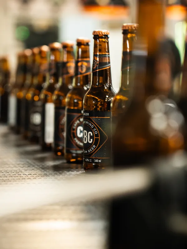 Bottles running down the line in the light