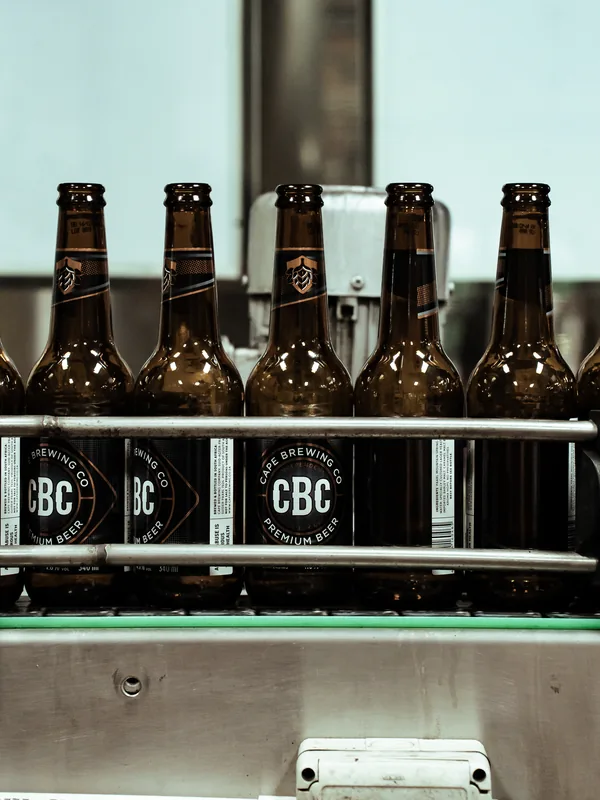 Labelled CBC bottles on the conveyor